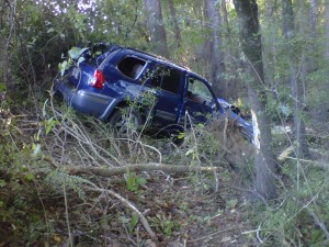 Driver OK after van goes over railing, down hill