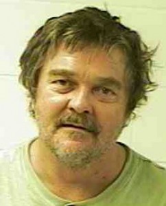 Man charged with leaving damage, curse word on truck
