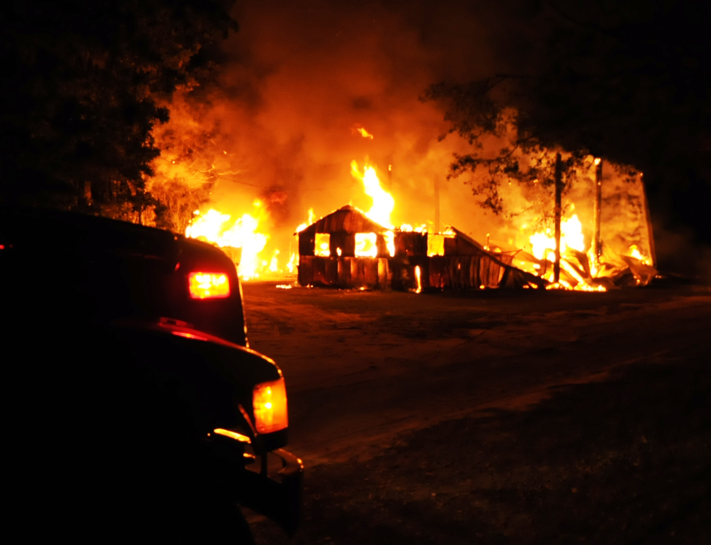 Trash fire spreads, burning large storage shed and travel 